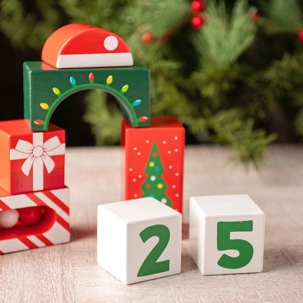 Holiday wooden blocks set up on a table.