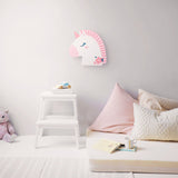 Unicorn night light on a wall