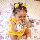 Little girl with panda ring rattle