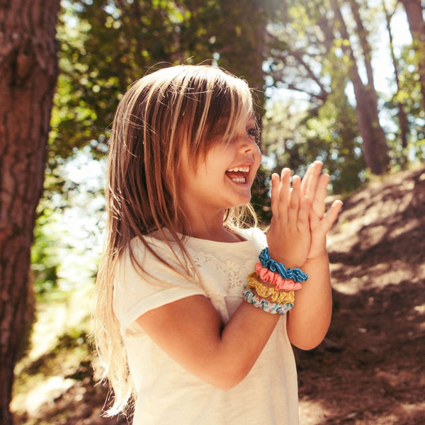 Little girl wearing spring mix scrunchies