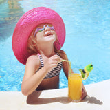 Little girl wearing sparkle goggles at the pool.
