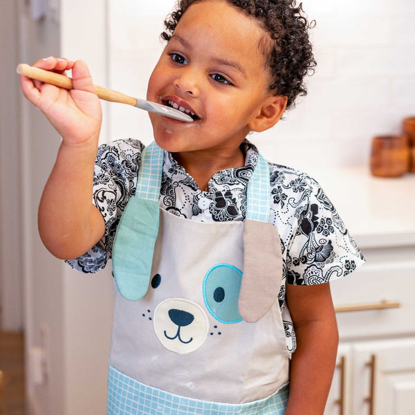 Little boy wearing Puppy apron