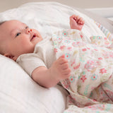 Baby with hedgehog muslin blanket