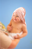 Baby with unicorn muslin hooded towel