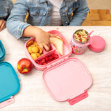 Fruit insulated food jar with bento box on a table.