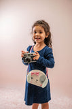 Little girl wearing puppy fashion purse