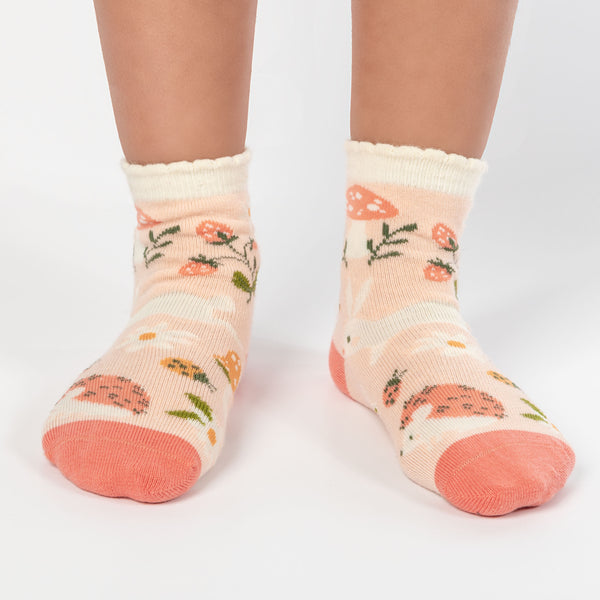 Child wearing strawberry fields toddler socks
