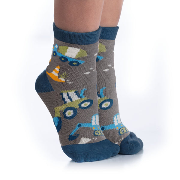 Child wearing grey construction toddler socks