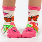 Child wearing butterfly toddler socks