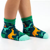 Child wearing multi dino toddler socks
