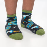 Child wearing gray space toddler socks