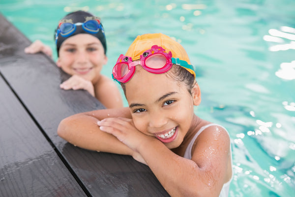 Kids wearing swim goggles at the pool 