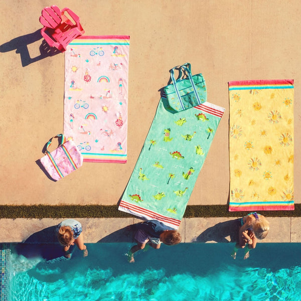 Beach and bath towels displayed by the pool. 