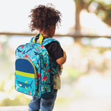 Little boy wearing shark classic backpack.