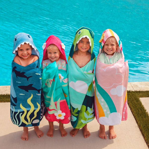Group of children wearing different hooded towels