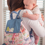 Baby with pink dino quilted backpack for baby 