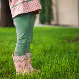 Child wearing strawberry fields rain boots